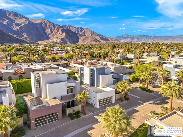 birds eye view of property with a mountain view