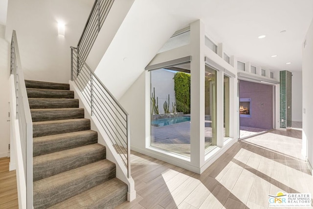 staircase featuring hardwood / wood-style floors