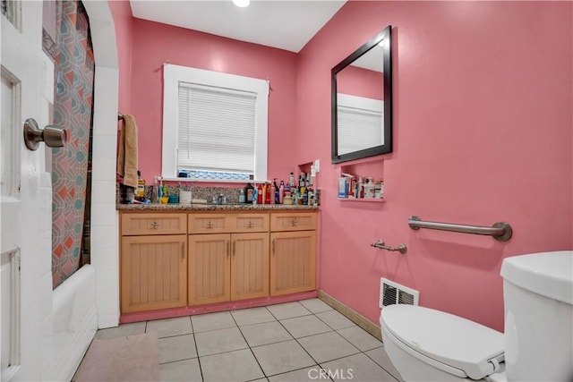 full bathroom with tile patterned floors, vanity, shower / bath combination with curtain, and toilet