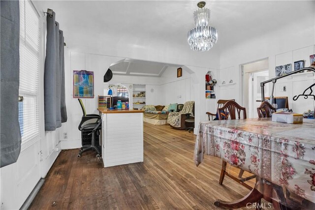 interior space with a chandelier and dark hardwood / wood-style flooring