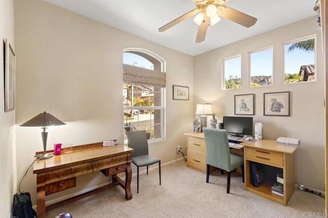 home office featuring ceiling fan and light colored carpet