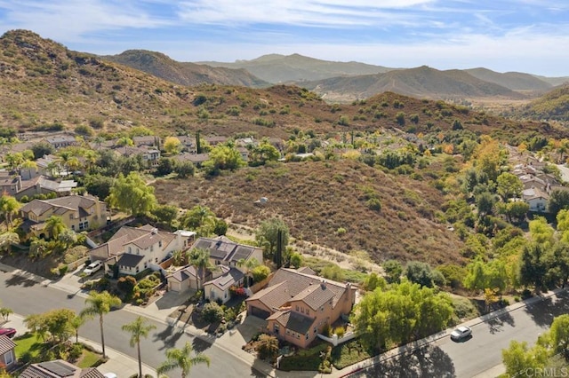 birds eye view of property featuring a mountain view