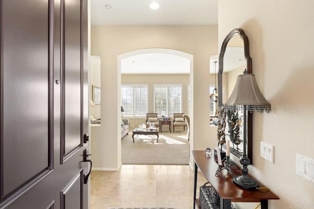 view of carpeted foyer entrance