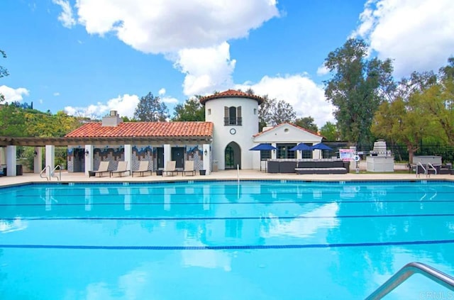 view of pool featuring a patio