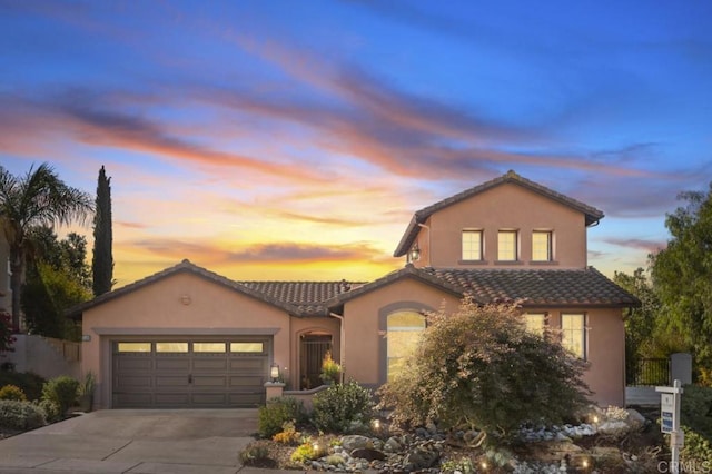 view of front of property with a garage