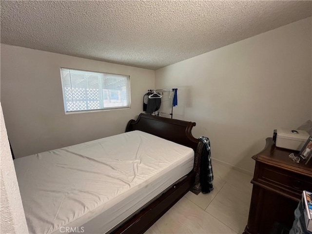 bedroom featuring a textured ceiling