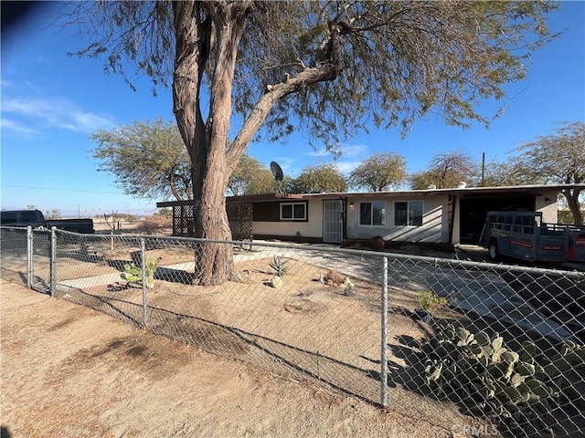 single story home with fence and an attached carport