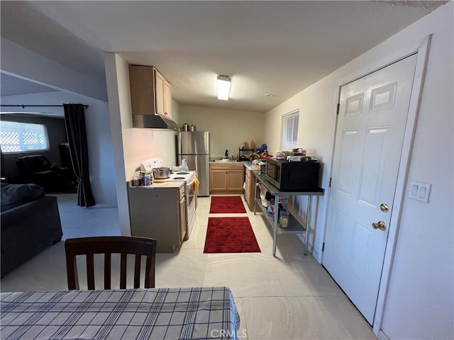 kitchen with light countertops, stainless steel appliances, open floor plan, and under cabinet range hood