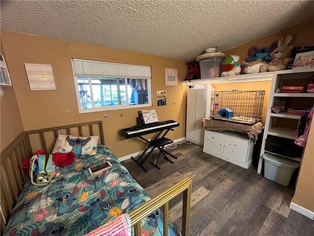 bedroom with a textured ceiling and dark hardwood / wood-style flooring