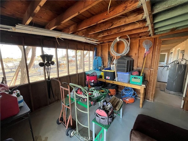 storage room featuring separate washer and dryer and water heater