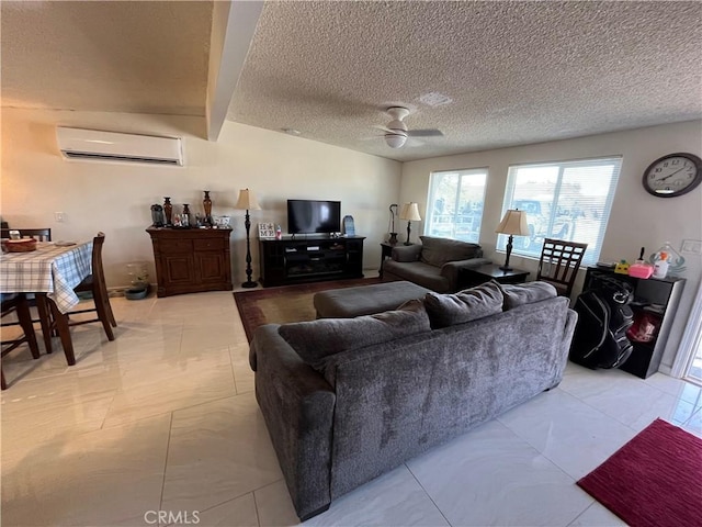 living room with ceiling fan, a wall mounted AC, beamed ceiling, and a textured ceiling