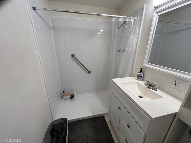 bathroom featuring vanity and a shower with shower curtain