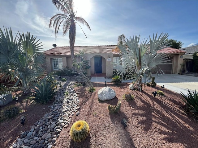 mediterranean / spanish house featuring a garage