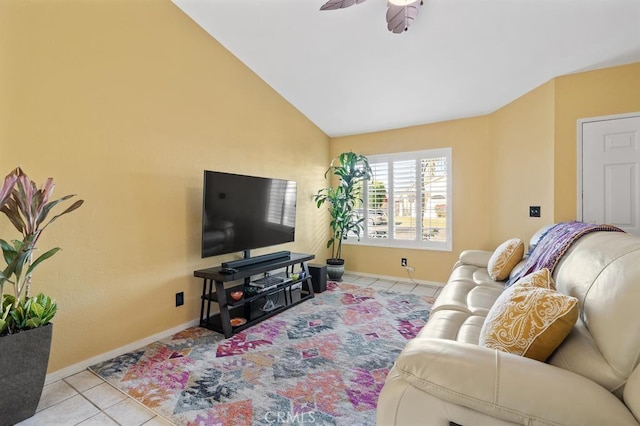 tiled living room featuring ceiling fan and vaulted ceiling