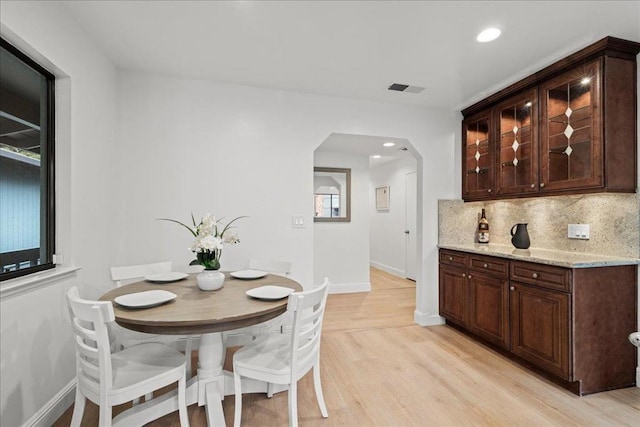 dining space with light hardwood / wood-style floors