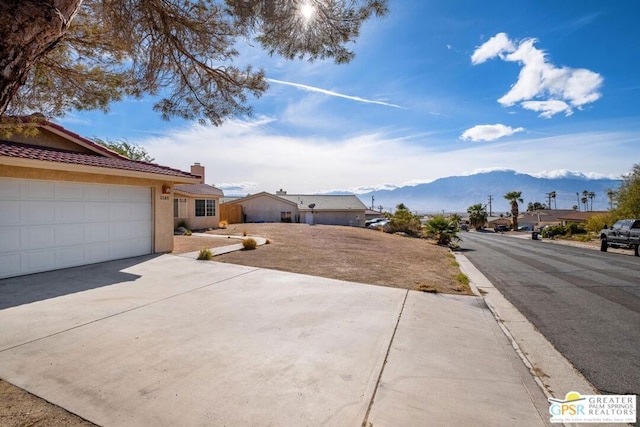 exterior space featuring a mountain view