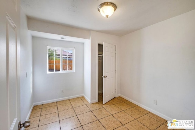 unfurnished bedroom featuring light tile patterned flooring