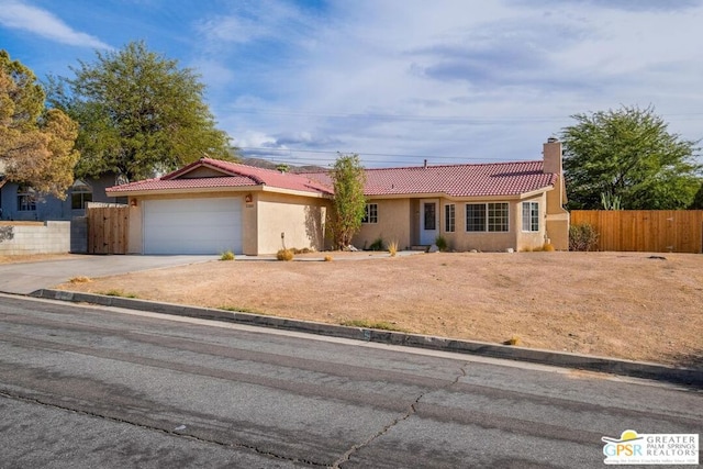 single story home featuring a garage