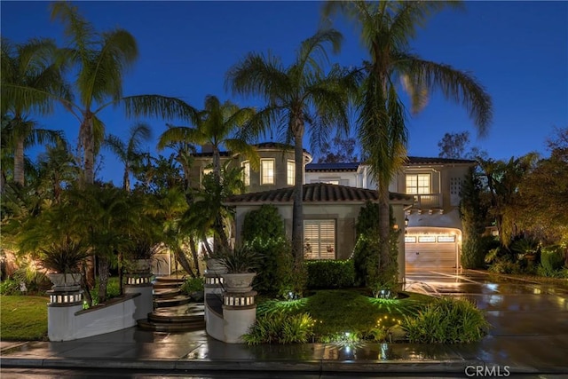 mediterranean / spanish-style house featuring a garage