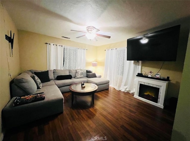 living room with hardwood / wood-style floors and ceiling fan