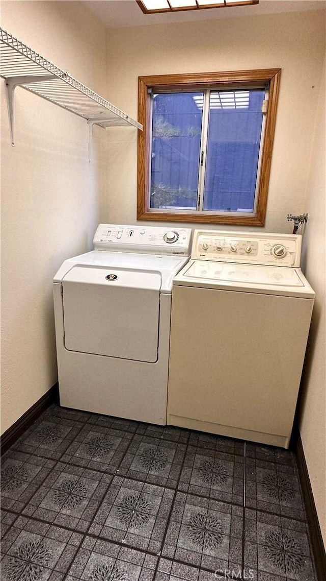 laundry room with independent washer and dryer