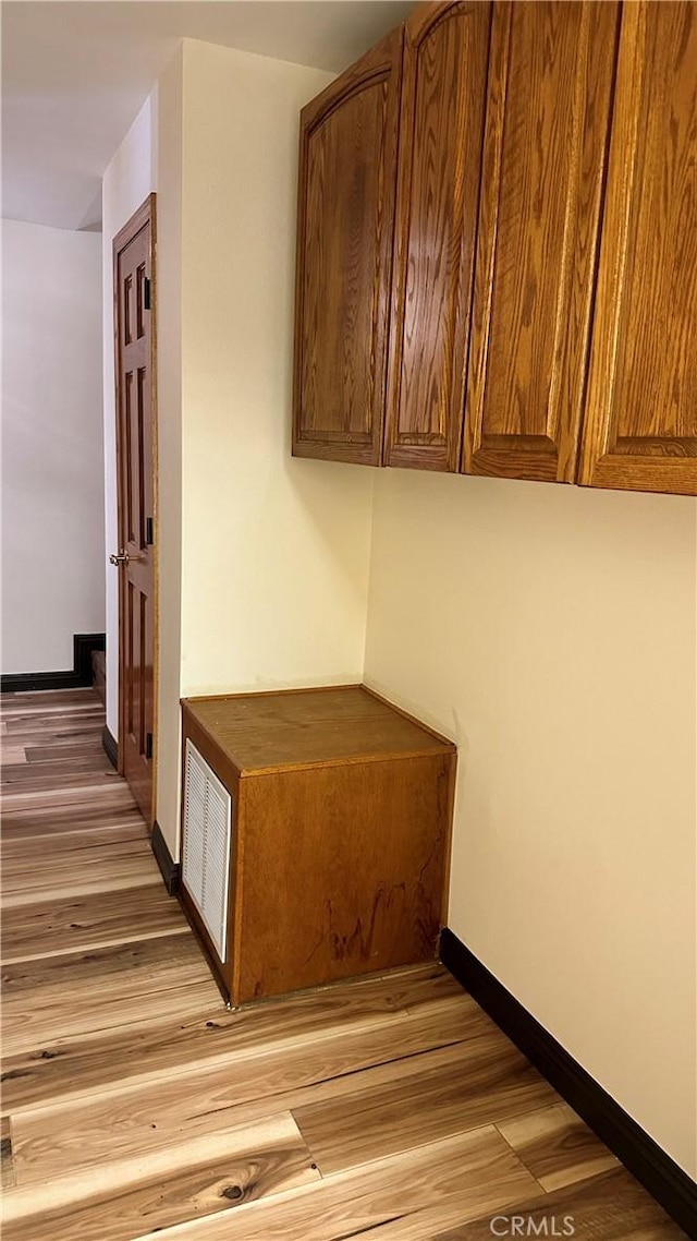 hallway featuring hardwood / wood-style flooring