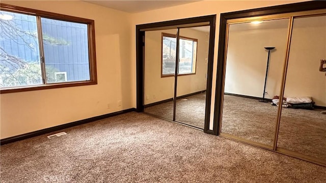 unfurnished bedroom featuring carpet