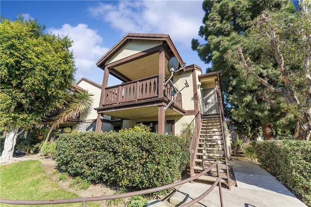 view of home's exterior featuring a balcony