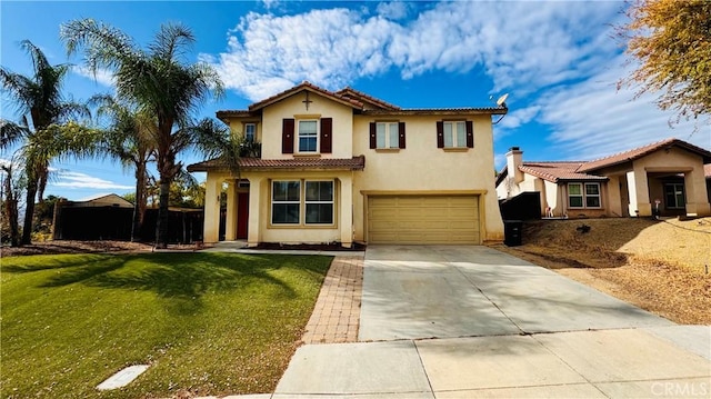 mediterranean / spanish house with a garage and a front lawn