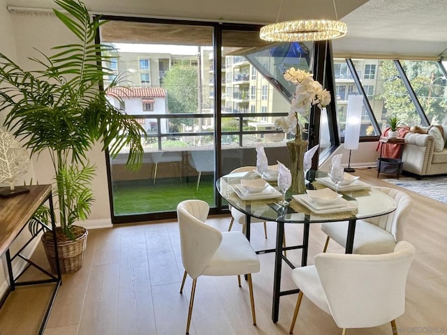 sunroom with a notable chandelier