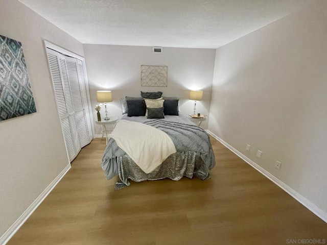 bedroom featuring a closet and hardwood / wood-style flooring