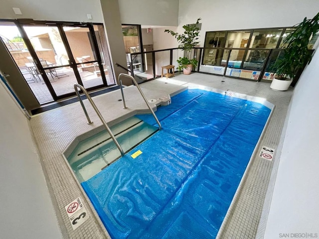 view of pool with french doors