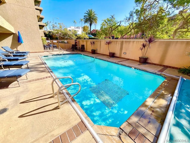 view of pool featuring a patio area