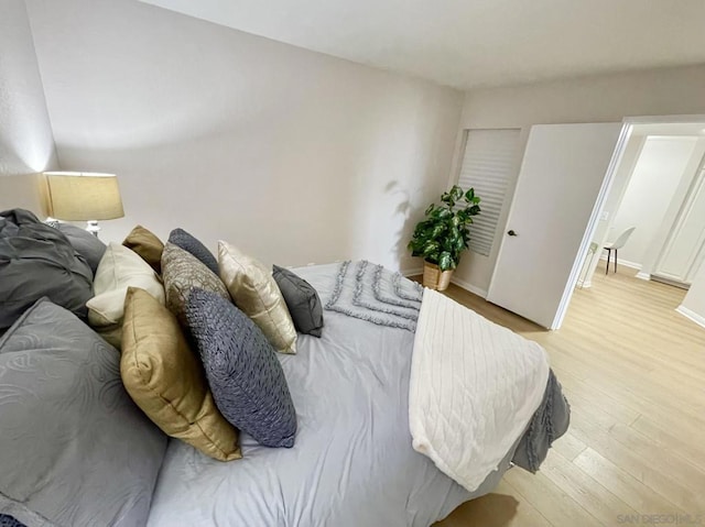 bedroom with light wood-type flooring