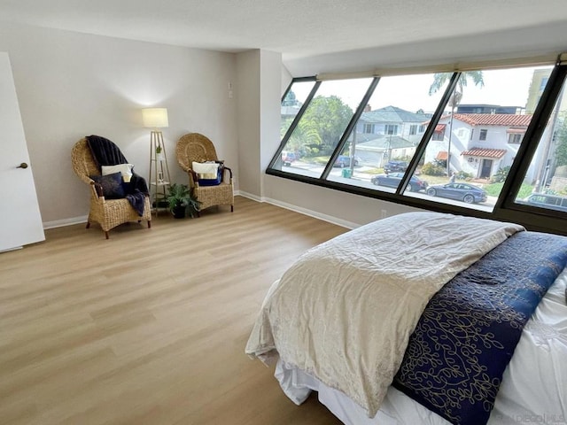 bedroom with wood-type flooring