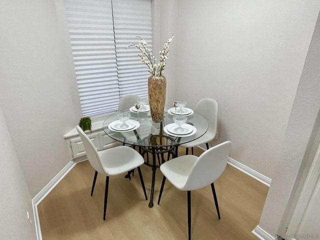 dining space featuring light hardwood / wood-style flooring