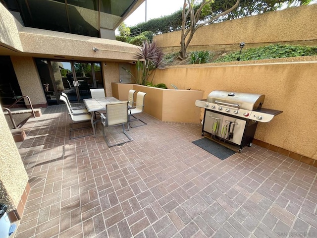 view of patio with a grill