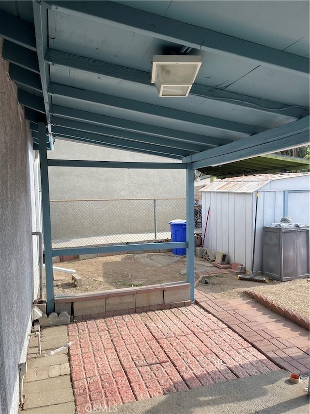 view of patio / terrace with a storage unit