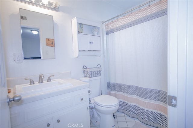 bathroom featuring toilet, vanity, a shower with curtain, and tile patterned floors