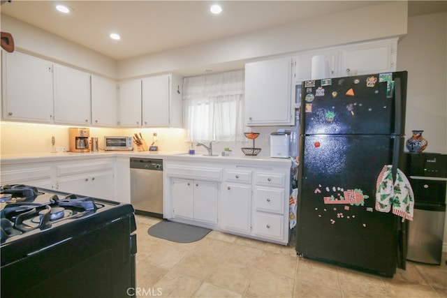 kitchen with black appliances, sink, and white cabinetry