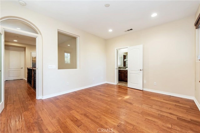 spare room with light hardwood / wood-style floors