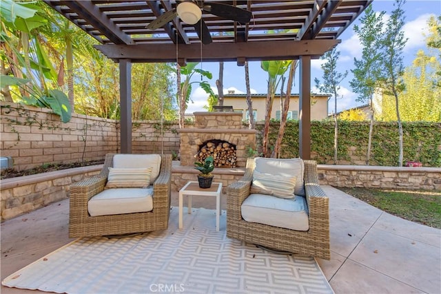 view of patio with a pergola, ceiling fan, and an outdoor stone fireplace