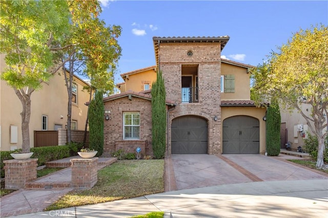 mediterranean / spanish house featuring a garage