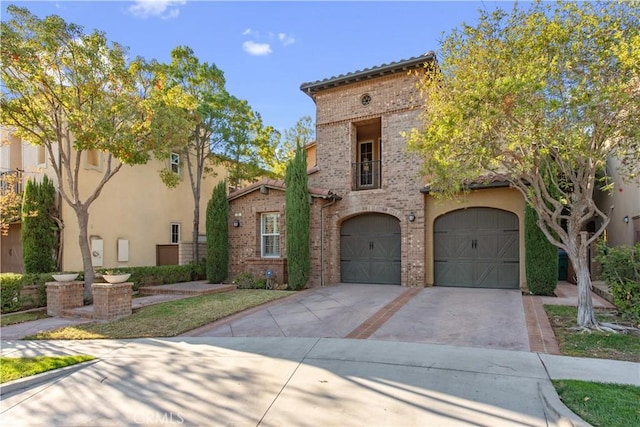 mediterranean / spanish-style house with a garage