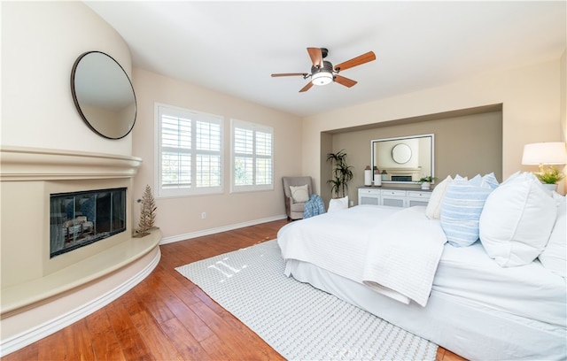 bedroom featuring hardwood / wood-style floors and ceiling fan