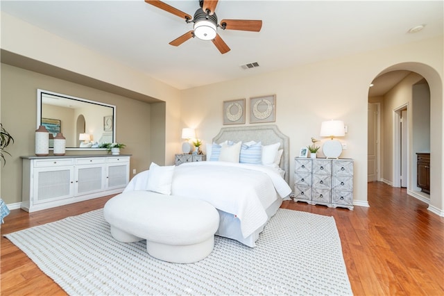 bedroom with wood-type flooring and ceiling fan