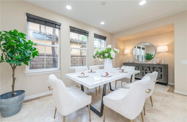 dining area with light tile patterned floors