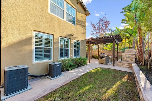 exterior space with a pergola, central air condition unit, a yard, and a patio