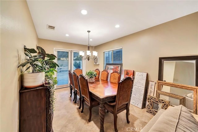 dining room featuring a chandelier