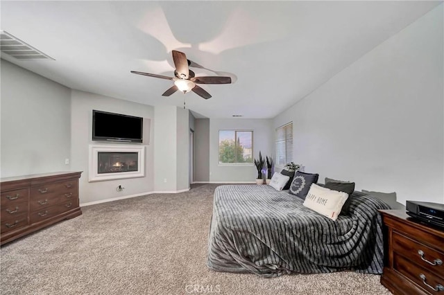 carpeted bedroom featuring ceiling fan